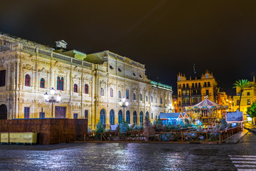 Fototapeta premium night view of the town hall of sevilla on the plaza de san francisco