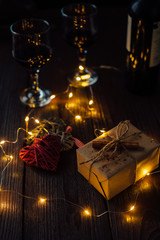 Valentine's Day. Romantic Composition of two hearts, box gift, lights and two glass of wine. Happy Valentine's Day.