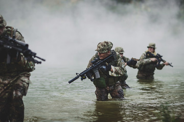 Fototapeta premium special forces soldiers with weapon take part in military maneuv
