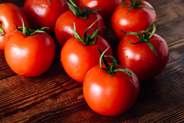 Some Red Tomatoes on Wooden Table