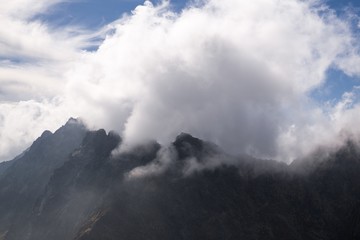 Fototapeta premium Peaks and clouds in High Tatras. Slovakia