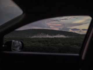 Rural scene, seen through car window