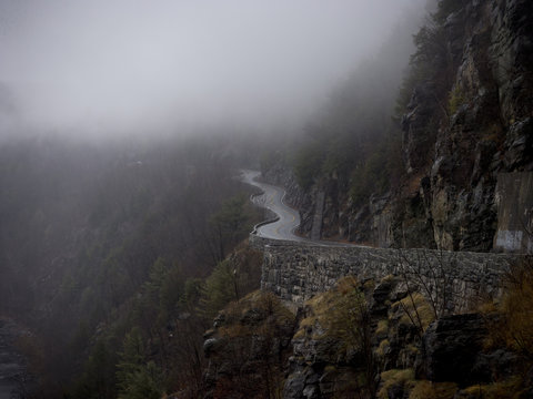 Winding mountain road, with mist