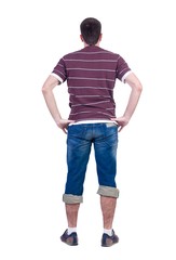 Obraz premium young man looks at white background. rear view.
