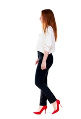 walking redhead business woman.