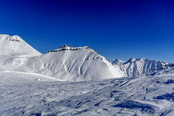 Winter in Greater Caucasus Mountains. Georgia (country). Gudauri ski resort. View from Mt. Kudebi.