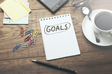 Obraz na płótnie Canvas goals text on notebook on the working table