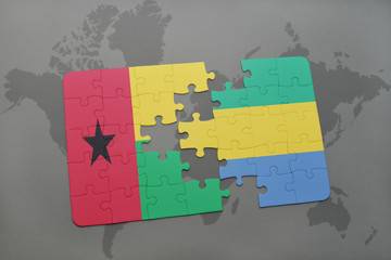 puzzle with the national flag of guinea bissau and gabon on a world map