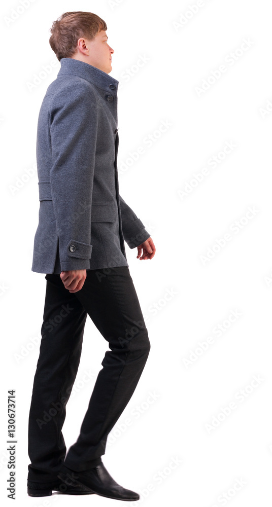 Canvas Prints back view of walking  business man. going young guy in gray shirt. Isolated over white background. Rear view people collection.  backside view of person.  