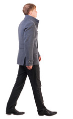Back view of going  handsome business man in coat.  walking young businessman . Rear view people collection.  backside view of person.  Isolated over white background.