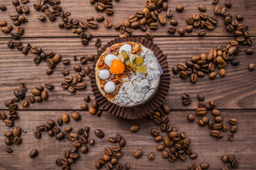 Fototapeta na wymiar Cake with cream on a dark wood background. Top view. Close-up