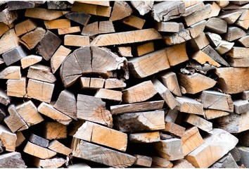 heap of firewoods  as background . Close - up .