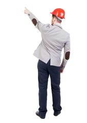 Back view of  pointing young men in helmet.