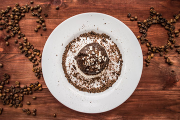 Cupcake with coffee beans on the table. Top view. Close-up