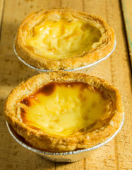 egg tart on wooden background for breakfast