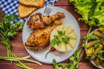 Fried chicken legs. Wooden rustic background. Top view. Close-up