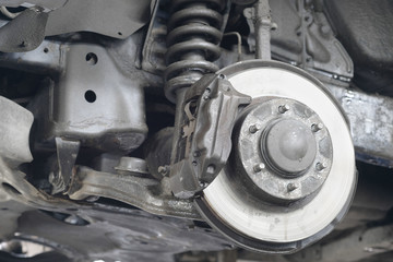 Fototapeta premium caliper of the car which is hung out on the lift