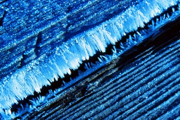 Wooden planks on a cold winter morning with hoar frost