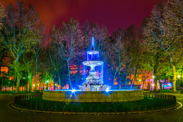 fountain situated on the plaza de colon square inside of the jardines de la merced gardens in the...