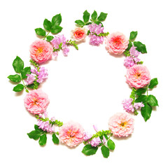 Wreath with leaves and flowers of pink roses isolated on white b
