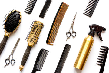 combs and hairdresser tools on white background top view