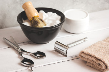 Wooden desktop with tools for shaving beards