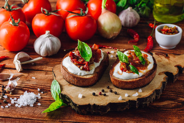 Two Toasts with Dried Tomatoes and Spicy Sauce