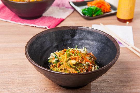 Traditional Japanese Chuka Wakame seaweed salad with sliced carrot, cucumber and Nut Sauce. Garnished with Sesame Seeds