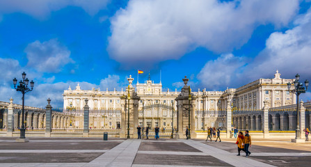 people are walking through grounds of the royal palace in the spanish capital madrid