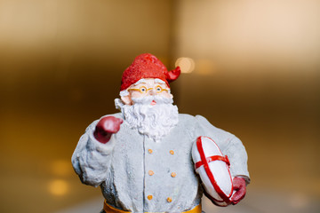 Statue of Santa Claus with modern look against a dark backdrop