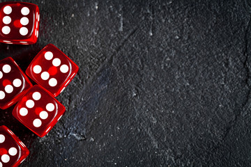 risk concept playing dice at dark background top view