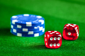 stack of chips play poker on green background close up