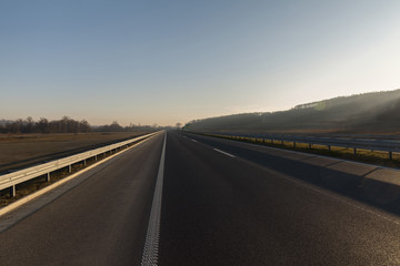 Fototapeta premium empty highway at sunset