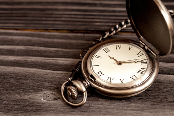 deadline concept pocket watch on wooden background