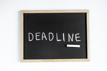 deadline concept on board at white background top view