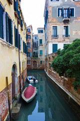 Typical Venice canal with moored boats