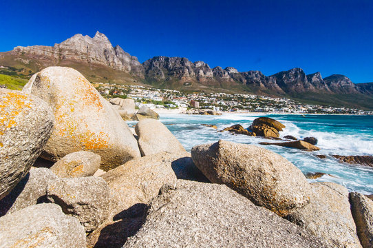 The coastal line of camps bay with the twelve apostle mountains behind it. Camps Bay is one of the most exclusive resort of south africa.