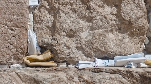 Man Place A Note In The Western Wall In Jerusalem Israel