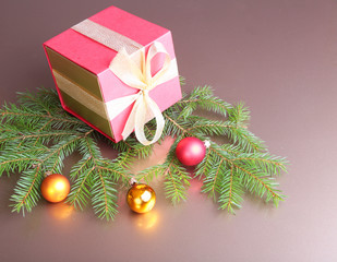 Gift box with christmas tree on wood background
