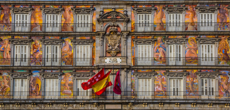 Detail of a decorated facade and balconies at the Palza Mayor, Madrid, Spain.