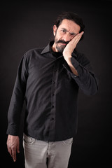 Obraz premium Handsome man doing different expressions in different sets of clothes: toothache