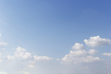 White clouds and blue sky background.