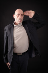 Obraz premium Handsome man doing different expressions in different sets of clothes: at attention