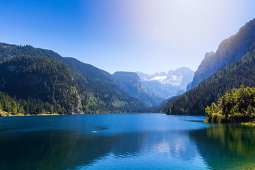 Naklejka na ściany i meble Fantastic azure alpine lake Vorderer Gosausee. Unusual and picturesque scene. Salzkammergut is a famous resort area located in the Gosau Valley in Upper Austria. Dachstein glacier. Beauty world.