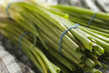 bunches of green onions, sometimes called long onions or scalions