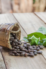 dried capsule seeds fruit of Sacha Inchi peanut on wooden