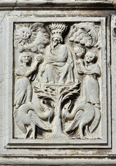 Fototapeta na wymiar God with Sun and Moon old relief in Venice