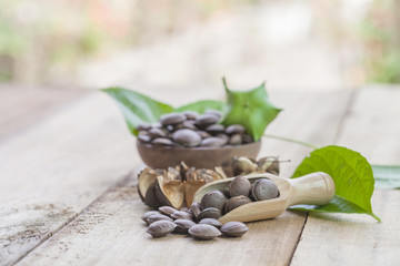 dried capsule seeds fruit of Sacha Inchi peanut on wooden