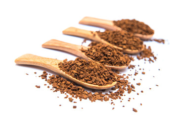 Instant coffee in wooden spoon on white background