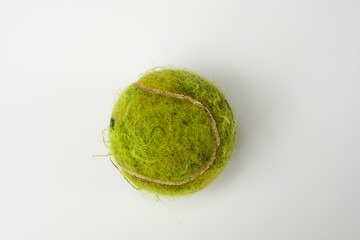 Old tennis ball with white background